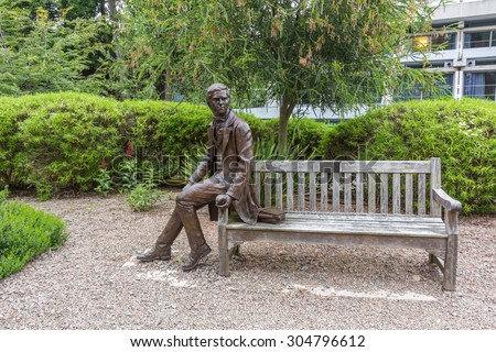 CAMBRIDGE, UK - JULY 24, 2015: Statue of Charles Darwin at Christ\'s College, University of Cambridge, England. He was an English naturalist, best known for his contributions to evolutionary theory.