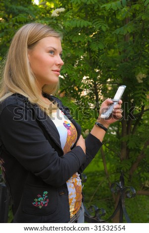 Young lady hang mobile phone in her hand