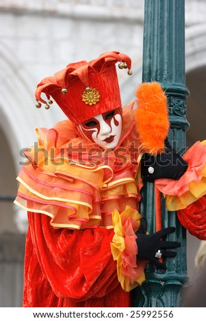 Venetian mask and costume of red joker