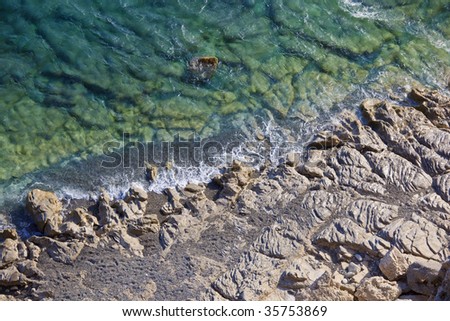 Unity and struggle of opposites - View from above on a rocky coast