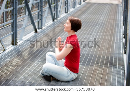 Modern young woman seeking for relaxation in urban environment