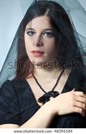 Portrait of a young girl under veil in Victorian style
