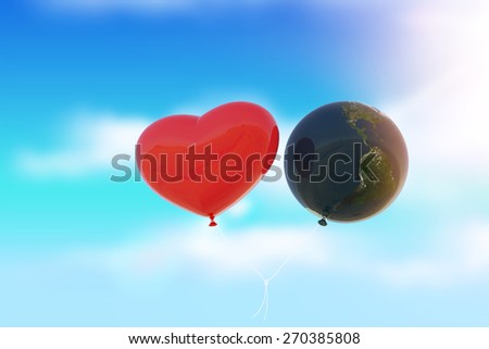 Heart and Earth Balloon  fly to sky in light flare ,Earth Day Concept.Elements of this image furnished by NASA
