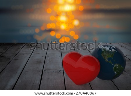 Heart and Earth ball on old wood and water bokeh background .Elements of this image furnished by NASA