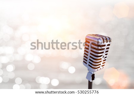 classic microphone on abstract blur Bokeh light for party 2017 background and Clipping path