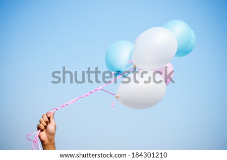 Pastel balloons , Blue, pink and white balloons ,white balloons  , Blue balloons ,  pink balloons  , hold balloons