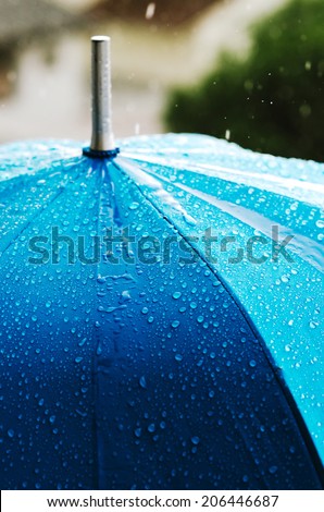 Rain drops on a blue umbrella , Raindrops on an umbrella , Rain drops shallow depth on blue , Raining Umbrella blue