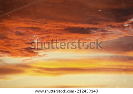 vintage sunset sky background with dark dramatic clouds , Retro style background