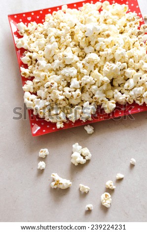 Popcorn on red plate ,Popcorn on red dish