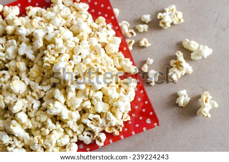 Popcorn on red plate ,Popcorn on red dish