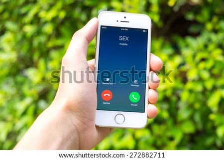 Hand holding smart phone with sex Incoming calls , Sex phone