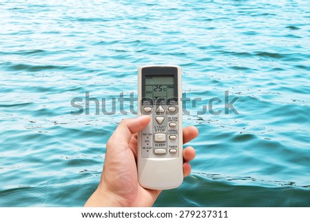 Hand held remote control direct to sunset water surface set temperature at 25 degree , controls imagine the weather