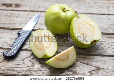Guava fruit cut on wooden