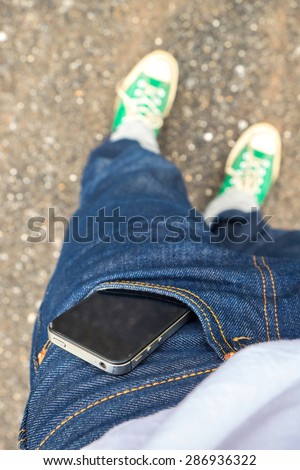 Mobile phone in pocket jeans