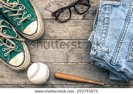 Concept Still life hipster man , Green Sneaker with jeans and glasses on wooden background , Lifestyle hipster