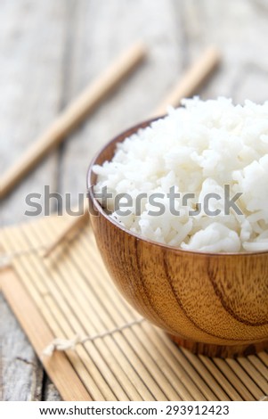 Steamed white rice in wooden cup on wooden , Thailand cooked rice in wooden bowl
