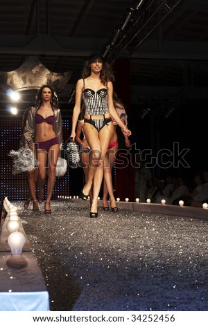 WARSAW, POLAND - AUGUST 27:  A model walks the runway at the New Face Agency  Fashion Show on August 27, 2007 in Warsaw Poland