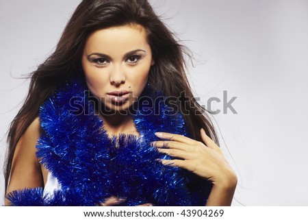 Portrait of Beautiful woman with blue chain on her neck