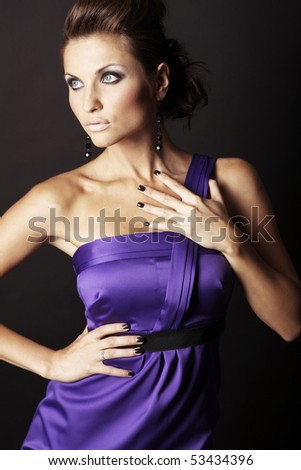 beautiful and sexy brunette fashion girl in violet dress - portrait