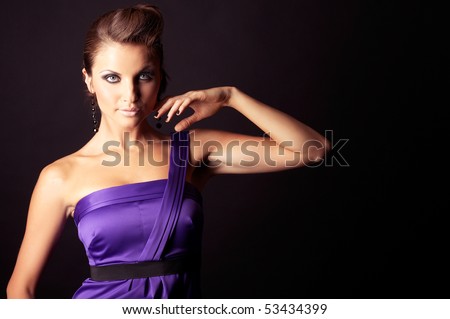 beautiful and sexy brunette fashion girl in violet dress - portrait