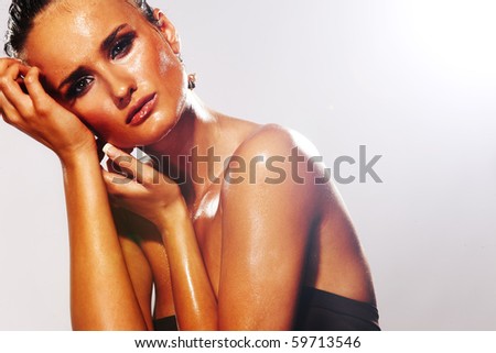 Wet Woman face -  fashion model on greay background