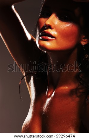 stock photo Hot and wet girl on dark background