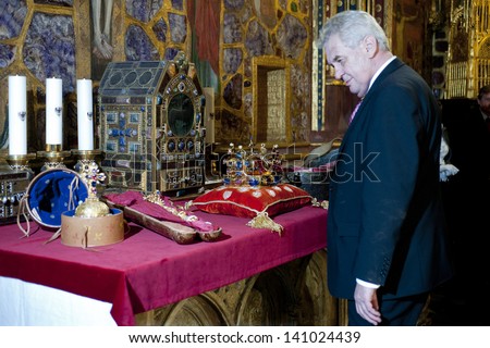 PRAGUE - MAY 9: Czech president Milos Zeman looking at Czech crown jewels during opening ceremony of exhibition in Prague castle, Czech republic, May 9, 2013