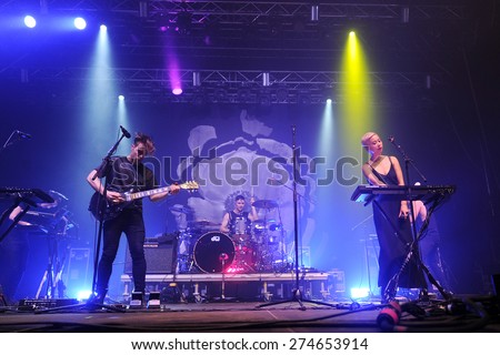 HRADEC KRALOVE - JULY 5: Thom Powers (L), Jesse Wood (C) and Alisa Xayalith (R) of The Naked and Famous during performance at festival Rock for People in Hradec Kralove, Czech republic, July 5, 2014.