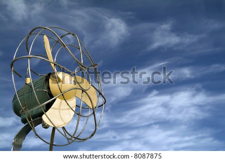 retro ventilator/fan against blue sky with cirrus clouds