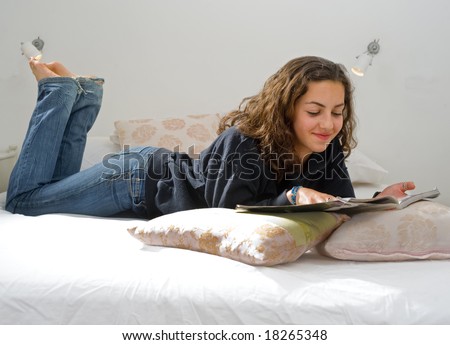 teenager girl lying in bed