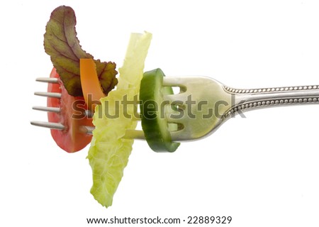 lettuce leave, orange pepper, cucumber and tomato on fork