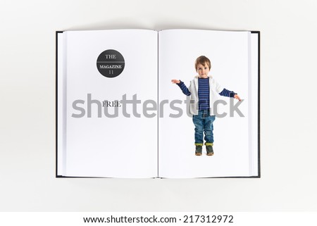 Boys making a victory sign printed on book