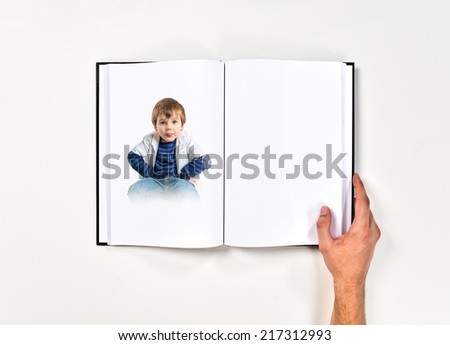 Boy making a mockery printed on book