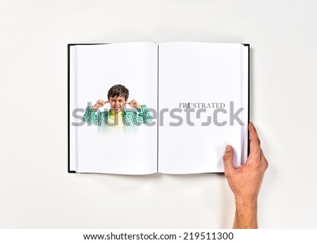 Boy covering his ears printed on book