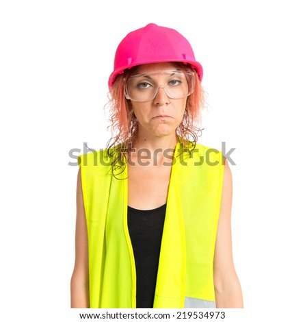 Sad worker woman with goggles over white background
