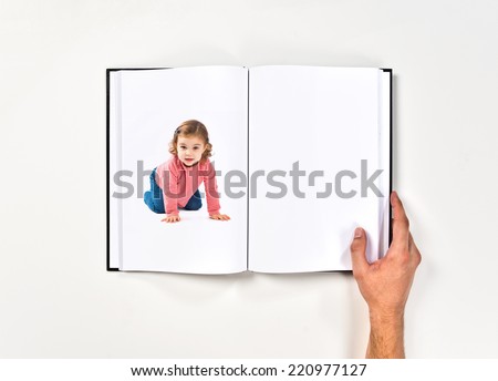 Little girl crawling printed on book