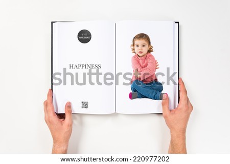 Little girl sitting printed on book