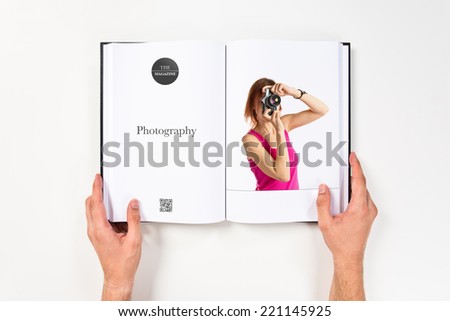 Girl taking a picture printed on book