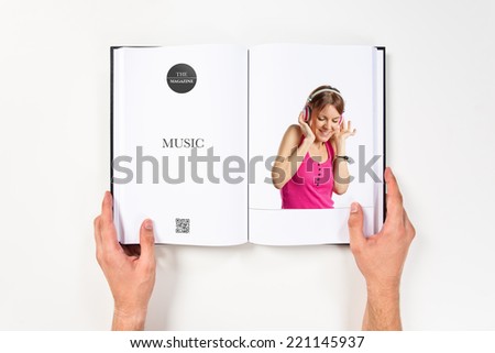 Young girl listening music printed on book