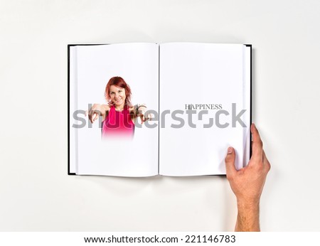 Young girl pointing printed on book
