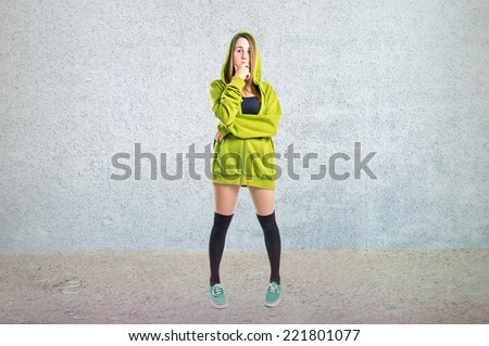Pretty young girl wearing urban style thinking