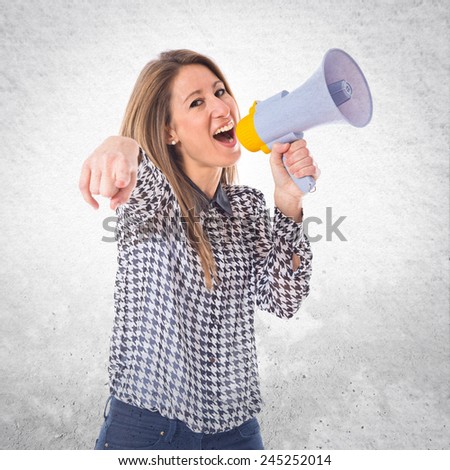 Woman shouting by megaphone