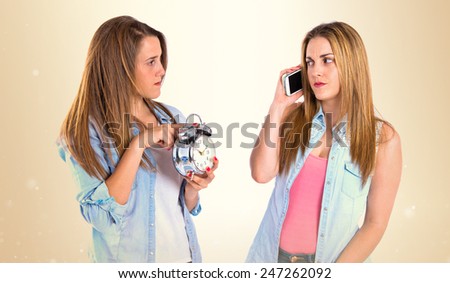 Angry girl with her friend because talk much on the phone