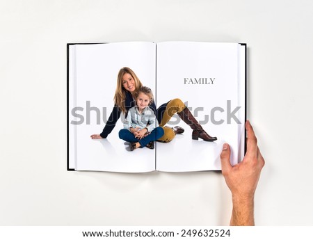 Mother and daughter together printed on book
