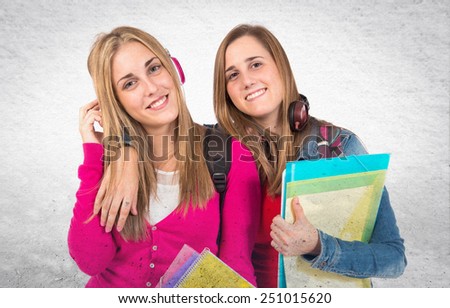 Students listening music over textured background