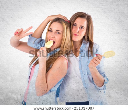 Friends eating ice cream over textured background