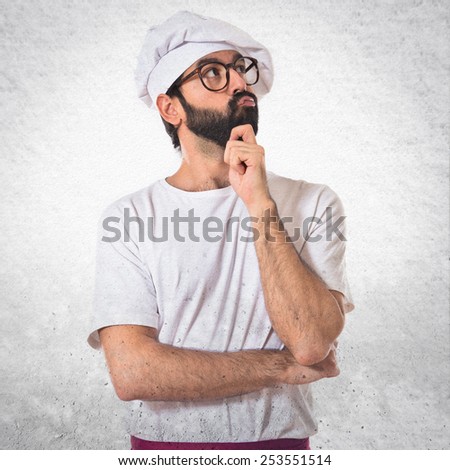 Chef thinking over white background