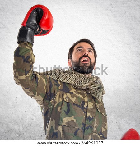 Soldier with boxing gloves