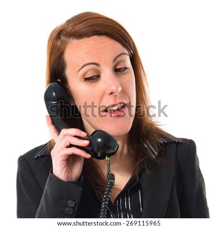 Business woman talking to vintage phone