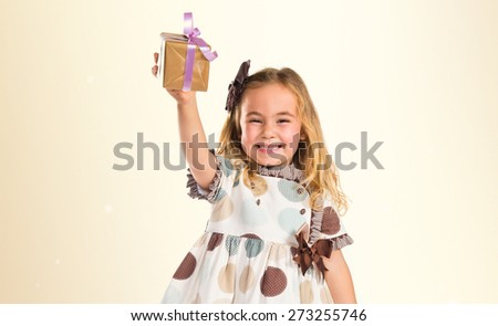 Little blonde girl with little gift